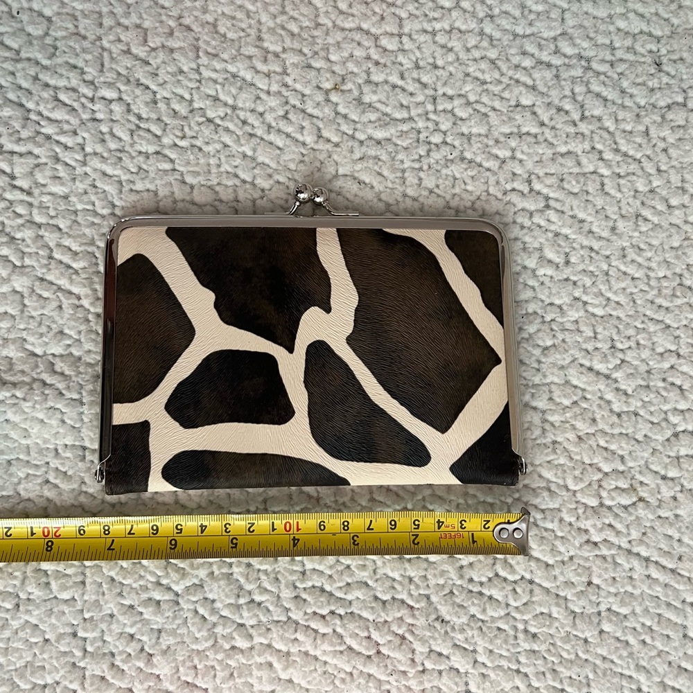 Beautiful giraffe print clutch.